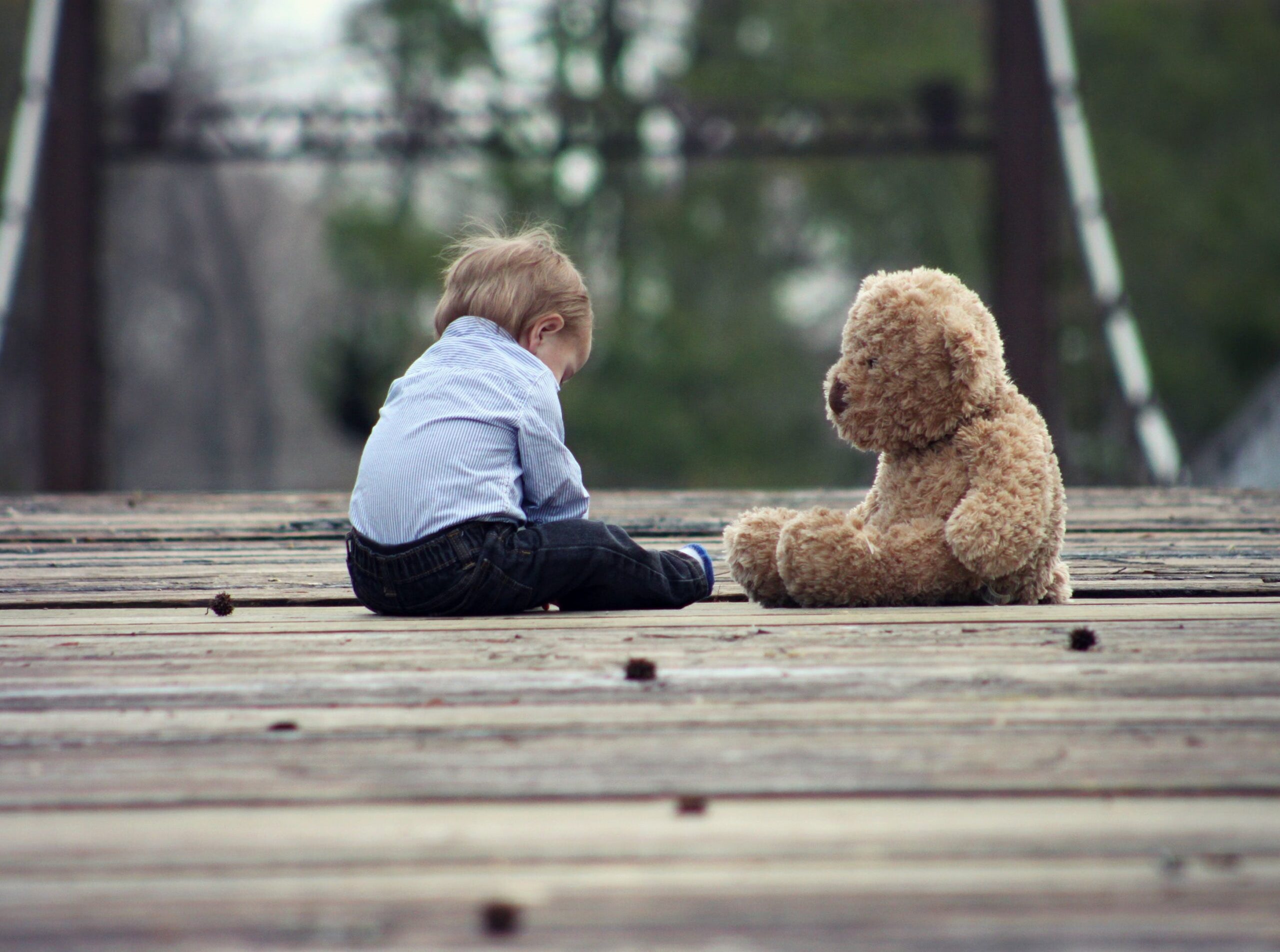 child with teddy bear